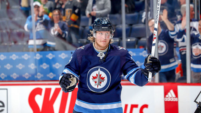 WINNIPEG, MB - MARCH 6: Patrik Laine #29 of the Winnipeg Jets salutes the fans after receiving second star honours following a 4-0 shutout victory over the Vegas Golden Knights at the Bell MTS Place on March 6, 2020 in Winnipeg, Manitoba, Canada.