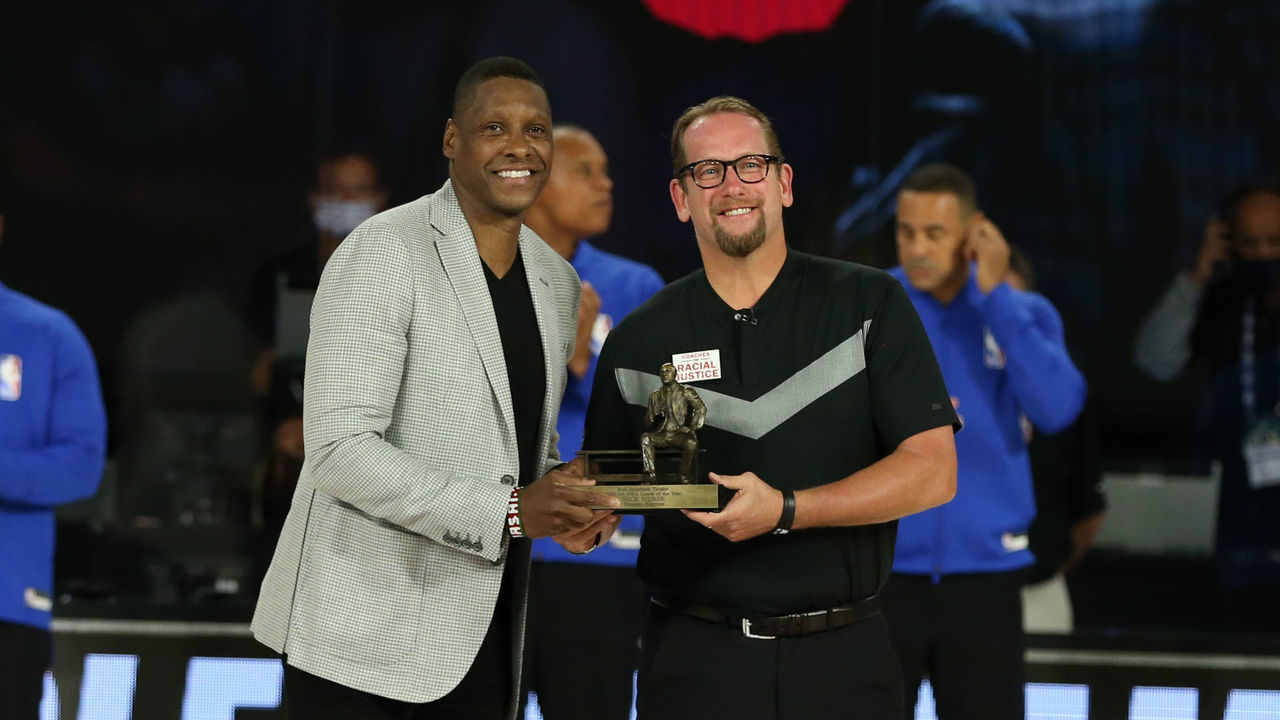 ORLANDO, FL - AUGUST 23: President of the Toronto Raptors, Masai Ujiri presents the 2019-2020 Coach of the Year Award to Head Coach, Nick Nurse of the Toronto Raptors before the game against the Brooklyn Nets during Round One, Game Four of the NBA Playoffs on August 23, 2020 at the The Field House at ESPN Wide World Of Sports Complex in Orlando, Florida. NOTE TO USER: User expressly acknowledges and agrees that, by downloading and/or using this Photograph, user is consenting to the terms and conditions of the Getty Images License Agreement. Mandatory Copyright Notice: Copyright 2020 NBAE