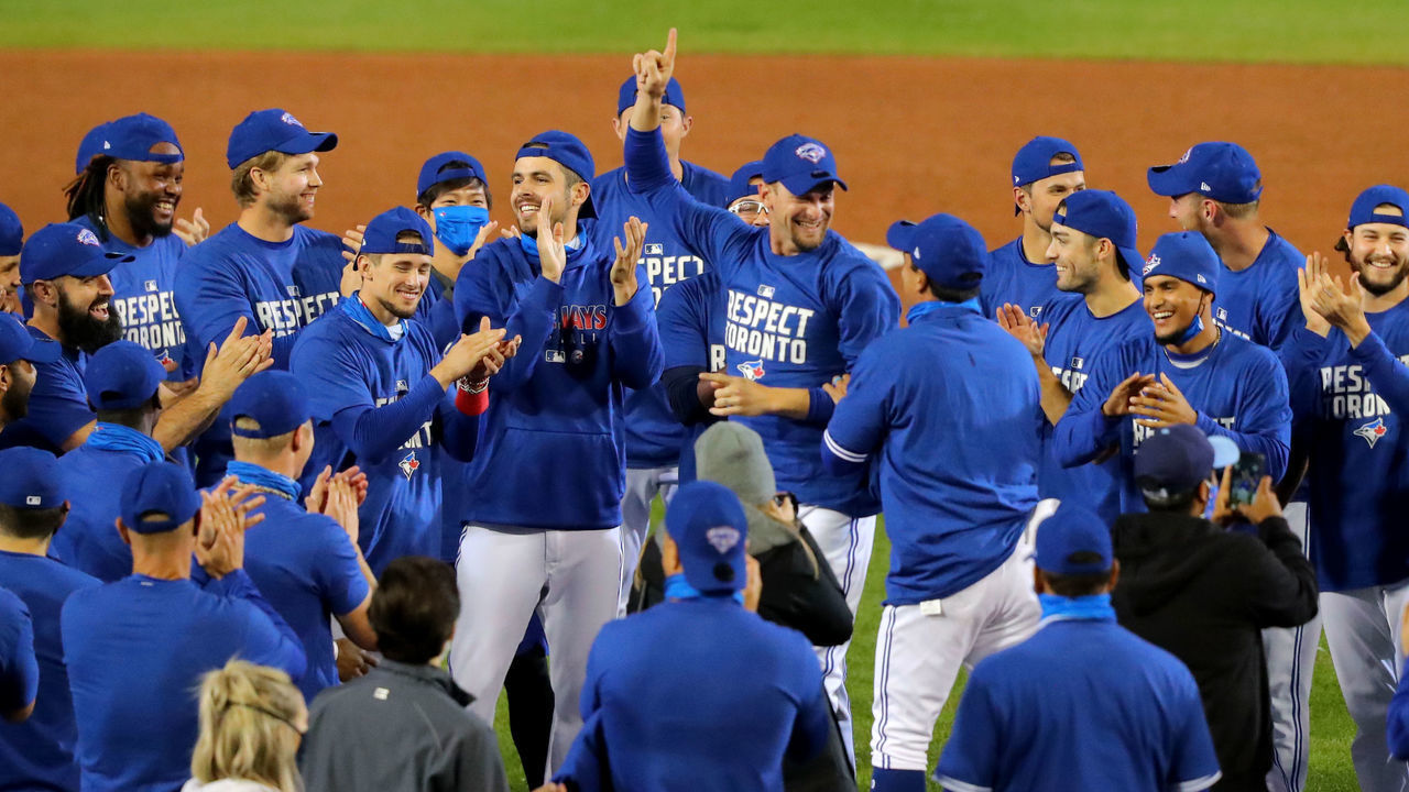 BUFFALO, NY - SEPTEMBER 24: The Toronto Blue Jays celebrate a win against the New York Yankees at Sahlen Field and celebrate a 2020 postseason berth on September 24, 2020 in Buffalo, New York. The Blue Jays are the home team due to the Canadian government's policy on COVID-19, which prevents them from playing in their home stadium in Canada. Blue Jays beat the Yankees 4 to 1.