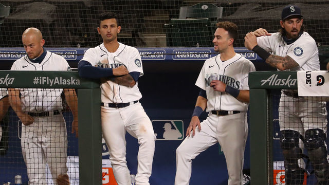 SEATTLE, WASHINGTON - SEPTEMBER 23: (L-R) Jose Marmolejos #26, Kyle Seager #15, Tim Lopes #10, Braden Bishop #5 and Joseph Odom #54 react in the eighth inning against the Houston Astros at T-Mobile Park on September 23, 2020 in Seattle, Washington.