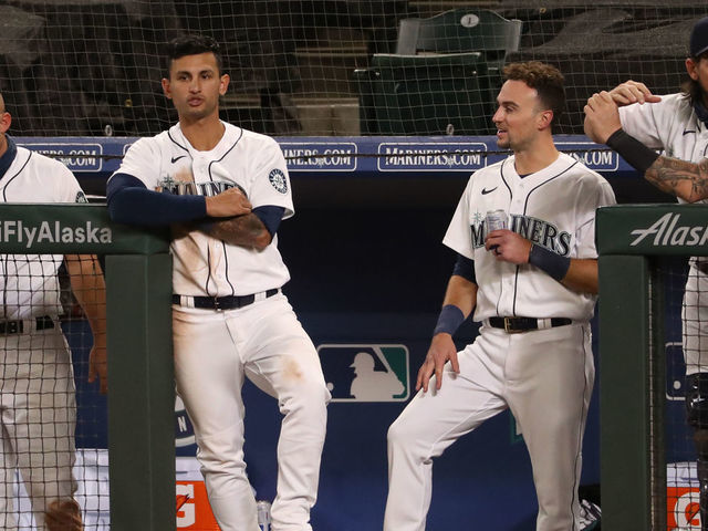 SEATTLE, WASHINGTON - SEPTEMBER 23: (L-R) Jose Marmolejos #26, Kyle Seager #15, Tim Lopes #10, Braden Bishop #5 and Joseph Odom #54 react in the eighth inning against the Houston Astros at T-Mobile Park on September 23, 2020 in Seattle, Washington.
