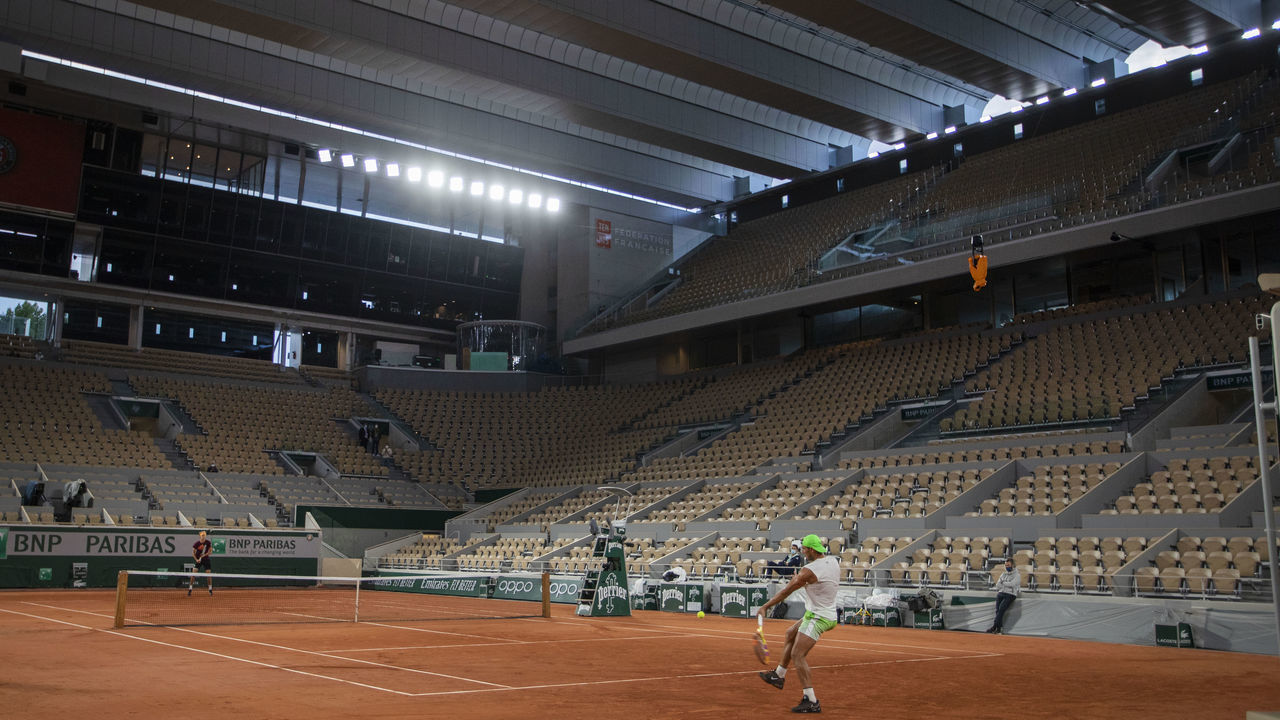 PARIS, FRANCE September 24. Rafael Nadal of Spain and Alexander Zverev of German during a practice match on Court Philippe-Chatrier under floodlights with the roof closed which are both new features to the 2020 French Open Tennis Tournament at Roland Garros on September 24th 2020 in Paris, France.