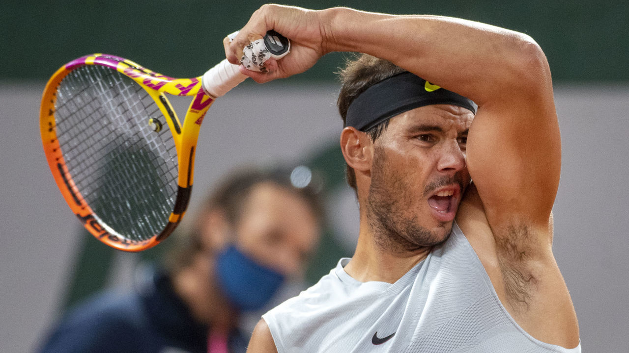 PARIS, FRANCE September 25. Rafael Nadal of Spain watched by coach Carlos Moya during his practice match with Filip Krajinovic of Serbia on Court Philippe-Chatrier in preparation for the 2020 French Open Tennis Tournament at Roland Garros on September 25th 2020 in Paris, France.