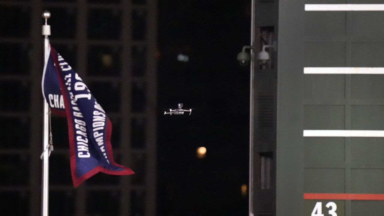 CHICAGO, ILLINOIS - SEPTEMBER 16: Play was halted during the fifth inning of the game between the Chicago Cubs and the Cleveland Indians when a drone landed on the grass in center field at Wrigley Field on September 16, 2020 in Chicago, Illinois.