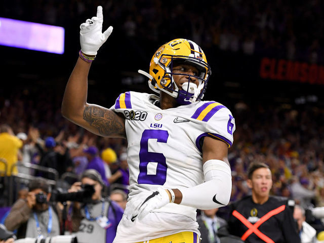 NEW ORLEANS, LA - JANUARY 13: Terrace Marshall Jr. #6 of the LSU Tigers celebrates after scoring a touchdown against the Clemson Tigers during the College Football Playoff National Championship held at the Mercedes-Benz Superdome on January 13, 2020 in New Orleans, Louisiana.