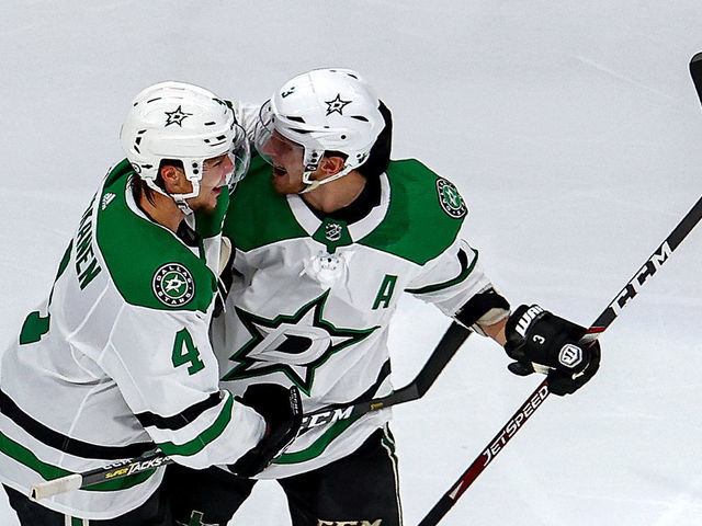 EDMONTON, ALBERTA - SEPTEMBER 04: Miro Heiskanen #4 and John Klingberg #3 of the Dallas Stars celebrate the game-winning goal by teammate Joel Kiviranta (not pictured) against the Colorado Avalanche during the first overtime period to win Game Seven of the Western Conference Second Round during the 2020 NHL Stanley Cup Playoffs at Rogers Place on September 04, 2020 in Edmonton, Alberta, Canada.