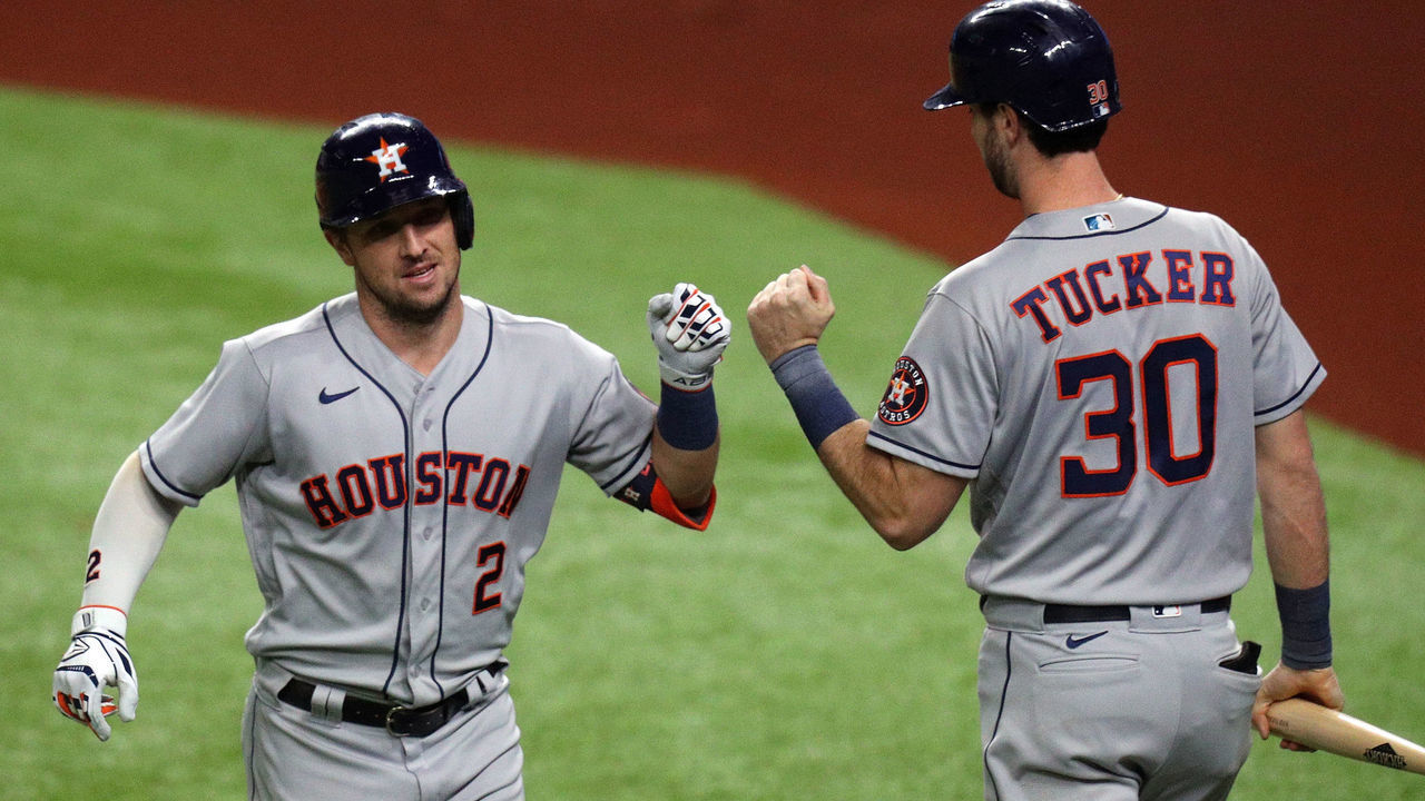 ARLINGTON, TEXAS - SEPTEMBER 25: Alex Bregman #2 of the Houston Astros fist bumps Kyle Tucker #30 after a solo home run against the Texas Rangers at Globe Life Field on September 25, 2020 in Arlington, Texas.