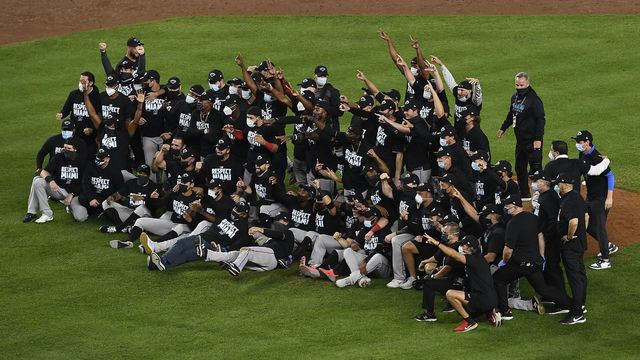 NEW YORK, NEW YORK - SEPTEMBER 25: The Miami Marlins celebrate during the tenth inning against the New York Yankees at Yankee Stadium on September 25, 2020 in the Bronx borough of New York City. The Marlins won 4-3 and clinched a playoff berth.
