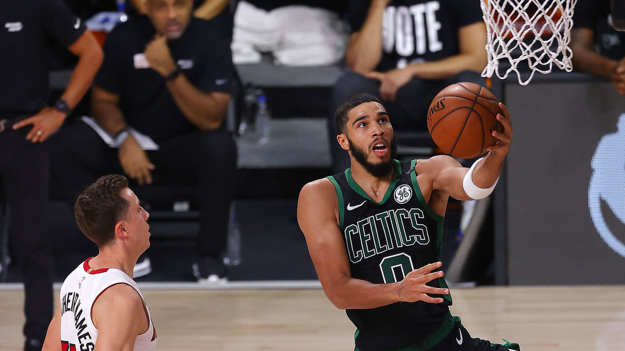 LAKE BUENA VISTA, FLORIDA - SEPTEMBER 25: Jayson Tatum #0 of the Boston Celtics goes for a lay-up against Duncan Robinson #55 of the Miami Heat during the fourth quarter in Game Five of the Eastern Conference Finals during the 2020 NBA Playoffs at AdventHealth Arena at the ESPN Wide World Of Sports Complex on September 25, 2020 in Lake Buena Vista, Florida.