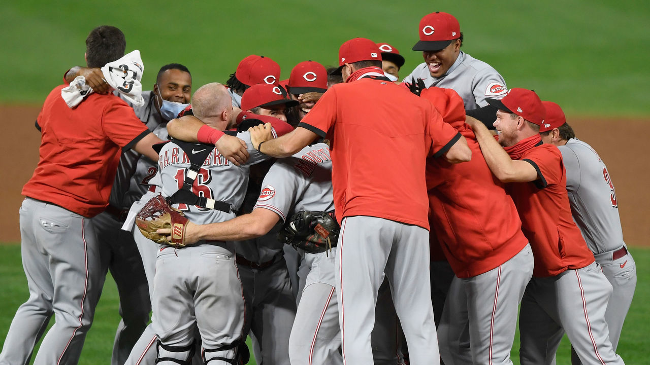 MINNEAPOLIS, MINNESOTA - SEPTEMBER 25: The Cincinnati Reds celebrate defeating the Minnesota Twins in the game at Target Field on September 25, 2020 in Minneapolis, Minnesota. The Reds defeated the Twins 7-2 to clinch a wild card spot in the postseason.