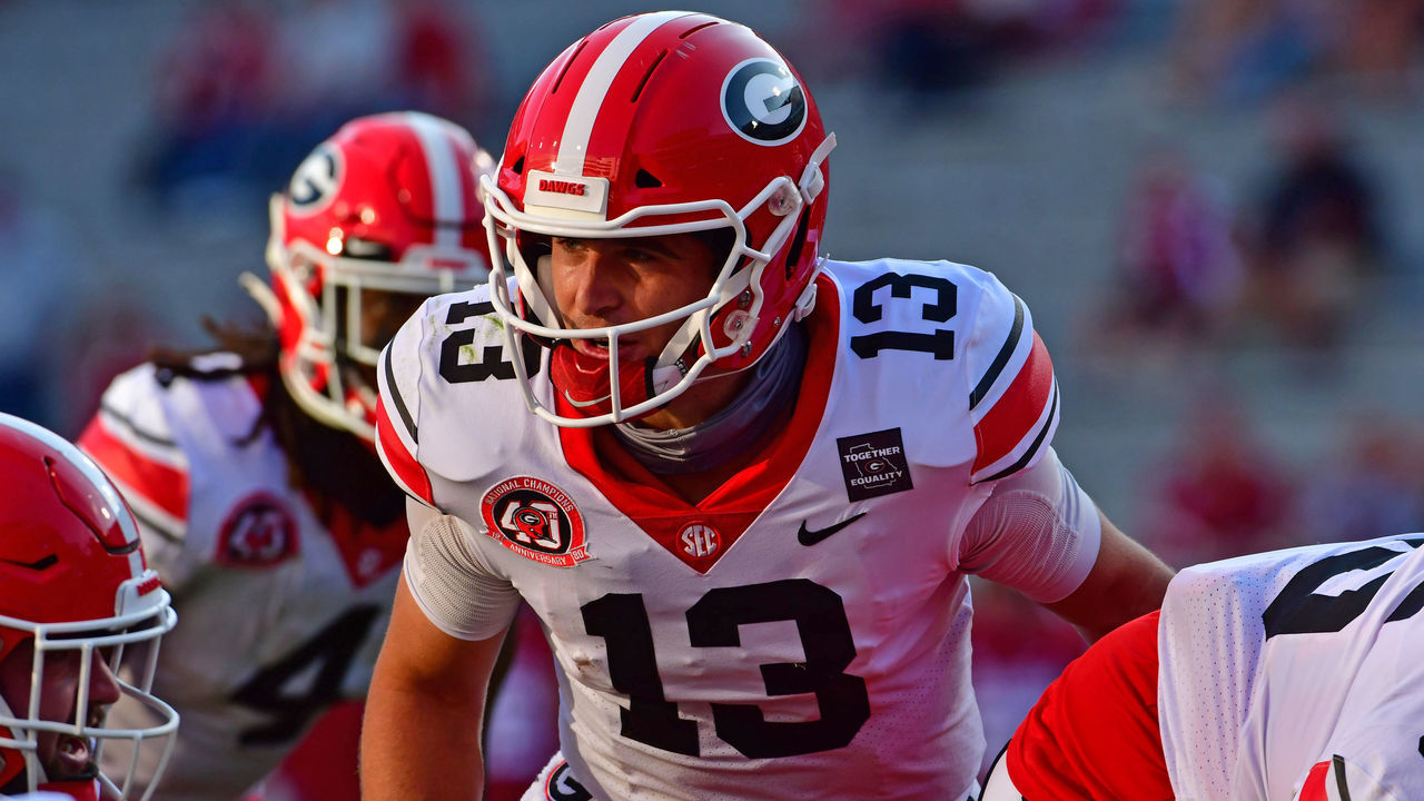 FAYETTEVILLE, AR - SEPTEMBER 26: Stetson Bennett #13 of the Georgia Bulldogs calls a play against the Arkansas Razorbacks on September 26, 2020 at Razorback Stadium in Fayetteville, Arkansas.