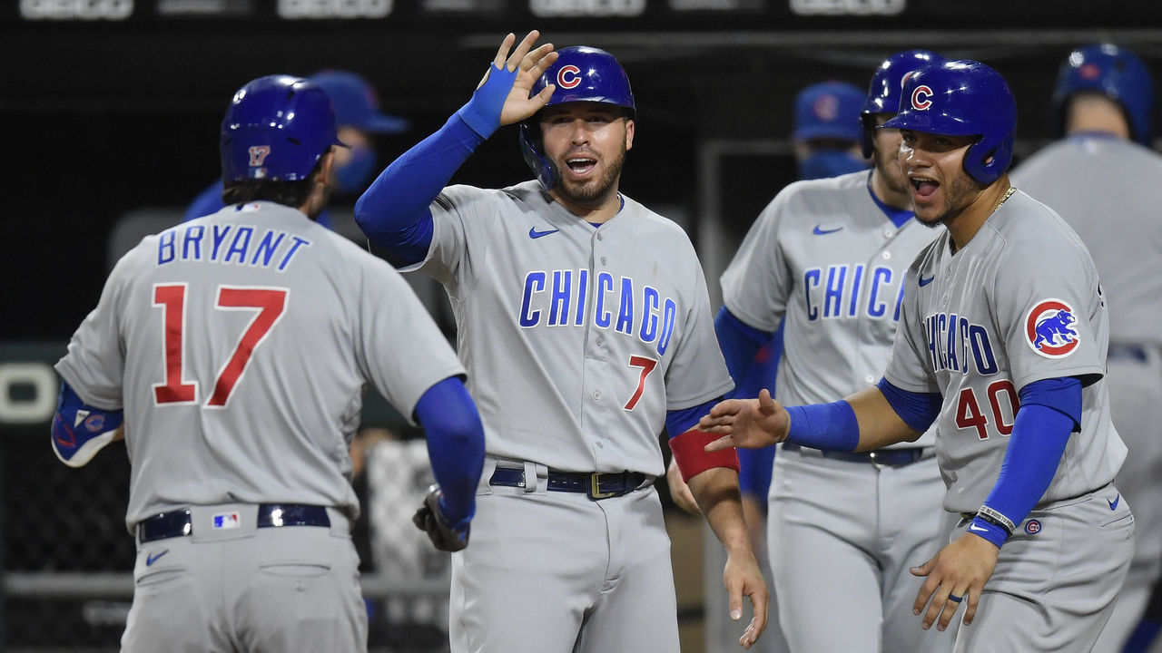 CHICAGO, ILLINOIS - SEPTEMBER 26: Kris Bryant #17 of the Chicago Cubs celebrates with Victor Caratini #7 and Willson Contreras #40 of the Chicago Cubs after his grand slam in the third inning against the Chicago White Sox at Guaranteed Rate Field on September 26, 2020 in Chicago, Illinois.