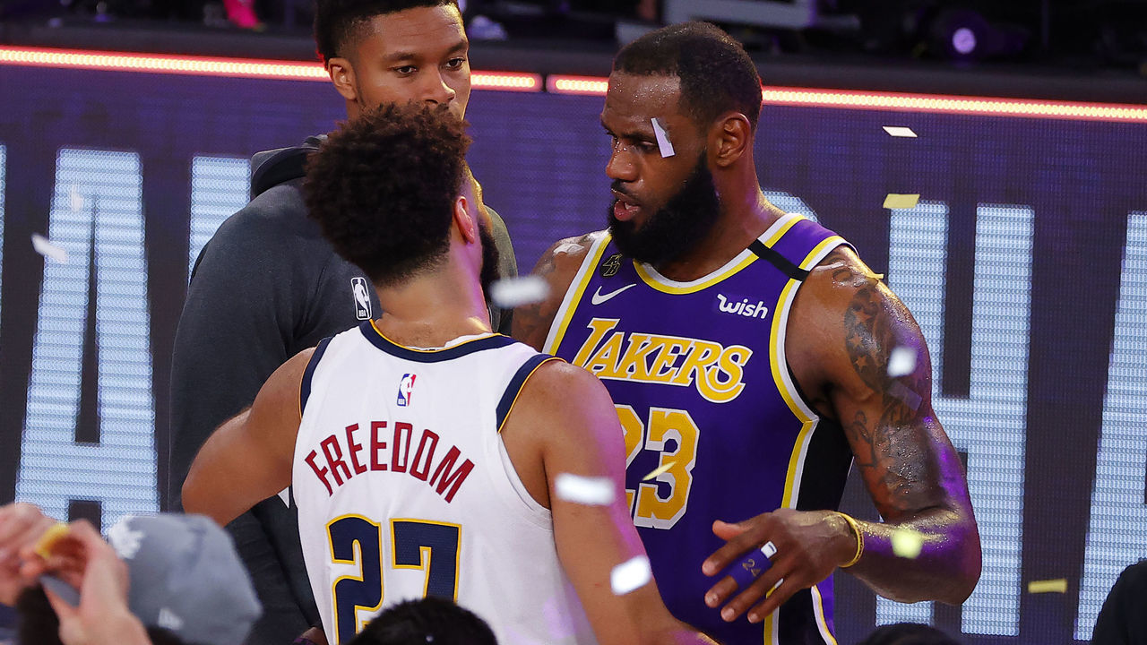 LAKE BUENA VISTA, FLORIDA - SEPTEMBER 26: LeBron James #23 of the Los Angeles Lakers hugs Jamal Murray #27 of the Denver Nuggets after their win in Game Five of the Western Conference Finals during the 2020 NBA Playoffs at AdventHealth Arena at the ESPN Wide World Of Sports Complex on September 26, 2020 in Lake Buena Vista, Florida.