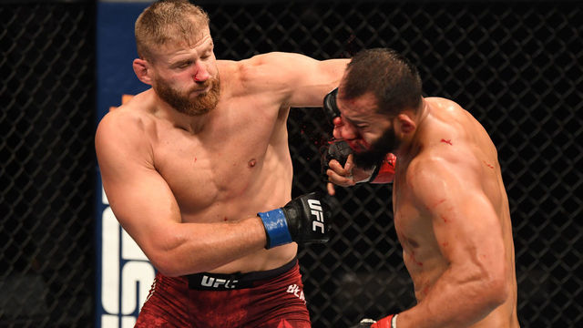 ABU DHABI, UNITED ARAB EMIRATES - SEPTEMBER 27: (L-R) Jan Blachowicz of Poland punches Dominick Reyes in their light heavyweight championship bout during UFC 253 inside Flash Forum on UFC Fight Island on September 27, 2020 in Abu Dhabi, United Arab Emirates.