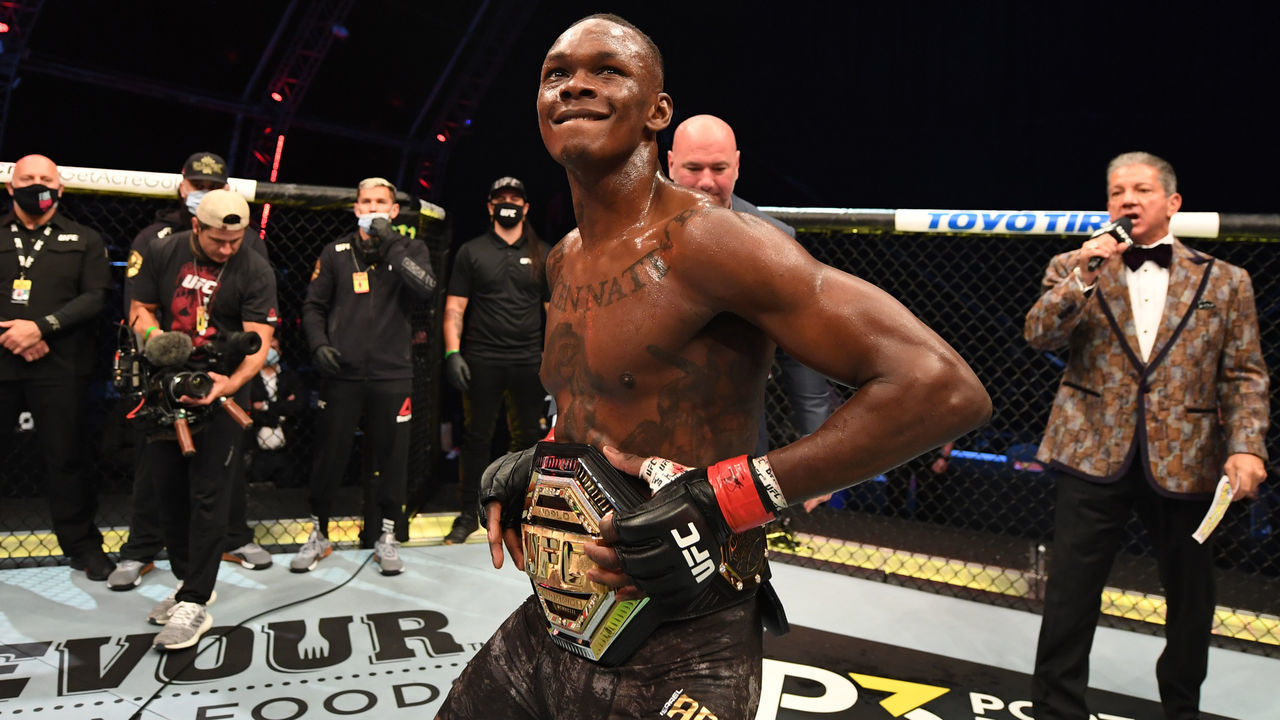 ABU DHABI, UNITED ARAB EMIRATES - SEPTEMBER 27: Israel Adesanya of Nigeria celebrates after defeating Paulo Costa of Brazil in their middleweight championship bout during UFC 253 inside Flash Forum on UFC Fight Island on September 27, 2020 in Abu Dhabi, United Arab Emirates.
