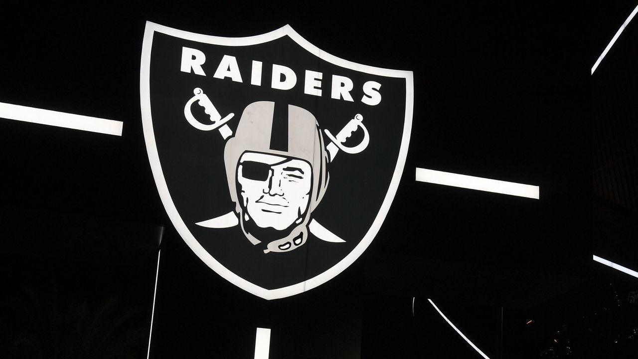 LAS VEGAS, NEVADA - SEPTEMBER 19: A Raiders logo is illuminated at the base of the marquee outside Allegiant Stadium, the USD 2 billion, 65,000-seat home of the Las Vegas Raiders, on September 19, 2020 in Las Vegas, Nevada. The Raiders will play their first game as Las Vegas' NFL franchise at the glass-domed facility against the New Orleans Saints on September 21, coinciding with the 50th anniversary of the league's first "Monday Night Football" broadcast.