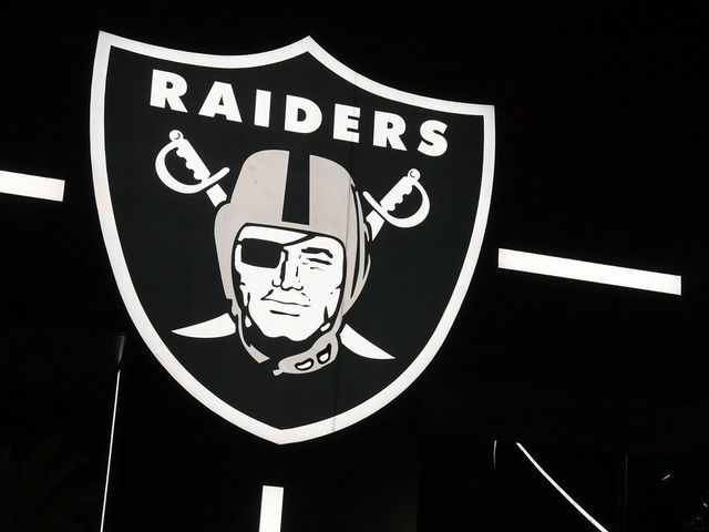 LAS VEGAS, NEVADA - SEPTEMBER 19: A Raiders logo is illuminated at the base of the marquee outside Allegiant Stadium, the USD 2 billion, 65,000-seat home of the Las Vegas Raiders, on September 19, 2020 in Las Vegas, Nevada. The Raiders will play their first game as Las Vegas' NFL franchise at the glass-domed facility against the New Orleans Saints on September 21, coinciding with the 50th anniversary of the league's first "Monday Night Football" broadcast.