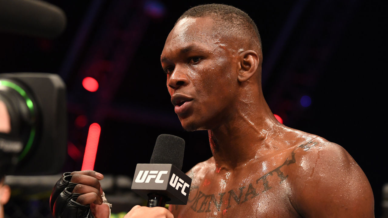 ABU DHABI, UNITED ARAB EMIRATES - SEPTEMBER 27: Israel Adesanya of Nigerian is interviewed after defeating Paulo Costa of Brazil in their middleweight championship bout during UFC 253 inside Flash Forum on UFC Fight Island on September 27, 2020 in Abu Dhabi, United Arab Emirates.