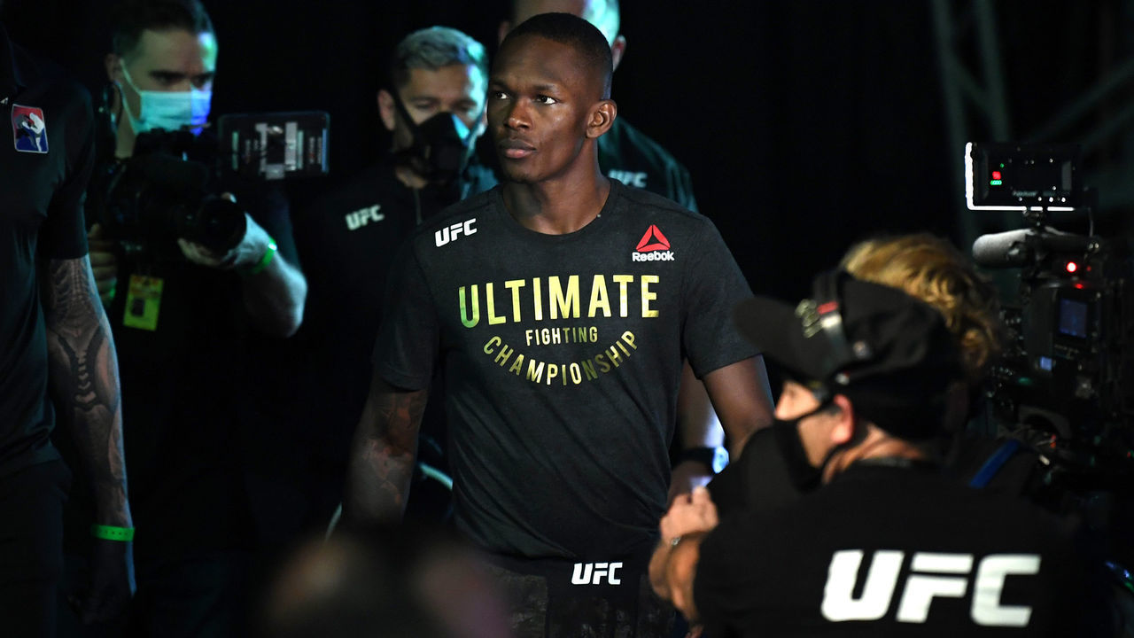 ABU DHABI, UNITED ARAB EMIRATES - SEPTEMBER 27: Israel Adesanya of Nigeria walks out towards the Octagon prior to facing Paulo Costa of Brazil in their middleweight championship bout during UFC 253 inside Flash Forum on UFC Fight Island on September 27, 2020 in Abu Dhabi, United Arab Emirates.
