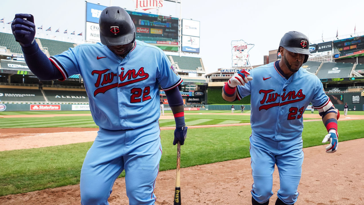MINNEAPOLIS, MN - SEPTEMBER 13: Nelson Cruz #23 of the Minnesota Twins celebrates his home run with Miguel Sano #22 against the Cleveland Indians on September 13, 2020 at Target Field in Minneapolis, Minnesota.