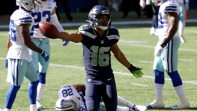 SEATTLE, WASHINGTON - SEPTEMBER 27: Tyler Lockett #16 of the Seattle Seahawks reacts after missing a catch due to a pass interference by Jourdan Lewis #26 of the Dallas Cowboys during the second quarter in the game at CenturyLink Field on September 27, 2020 in Seattle, Washington.