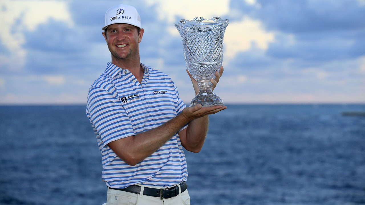 PUNTA CANA, DOMINICAN REPUBLIC - SEPTEMBER 27: Hudson Swafford poses with the trophy after putting in to win on the 18th green during the final round of the Corales Puntacana Resort & Club Championship on September 27, 2020 in Punta Cana, Dominican Republic.