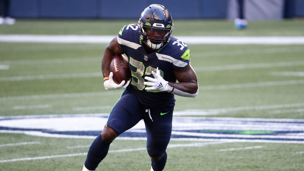 SEATTLE, WASHINGTON - SEPTEMBER 20: Chris Carson #32 of the Seattle Seahawks runs with the ball in the first quarter against the New England Patriots at CenturyLink Field on September 20, 2020 in Seattle, Washington.