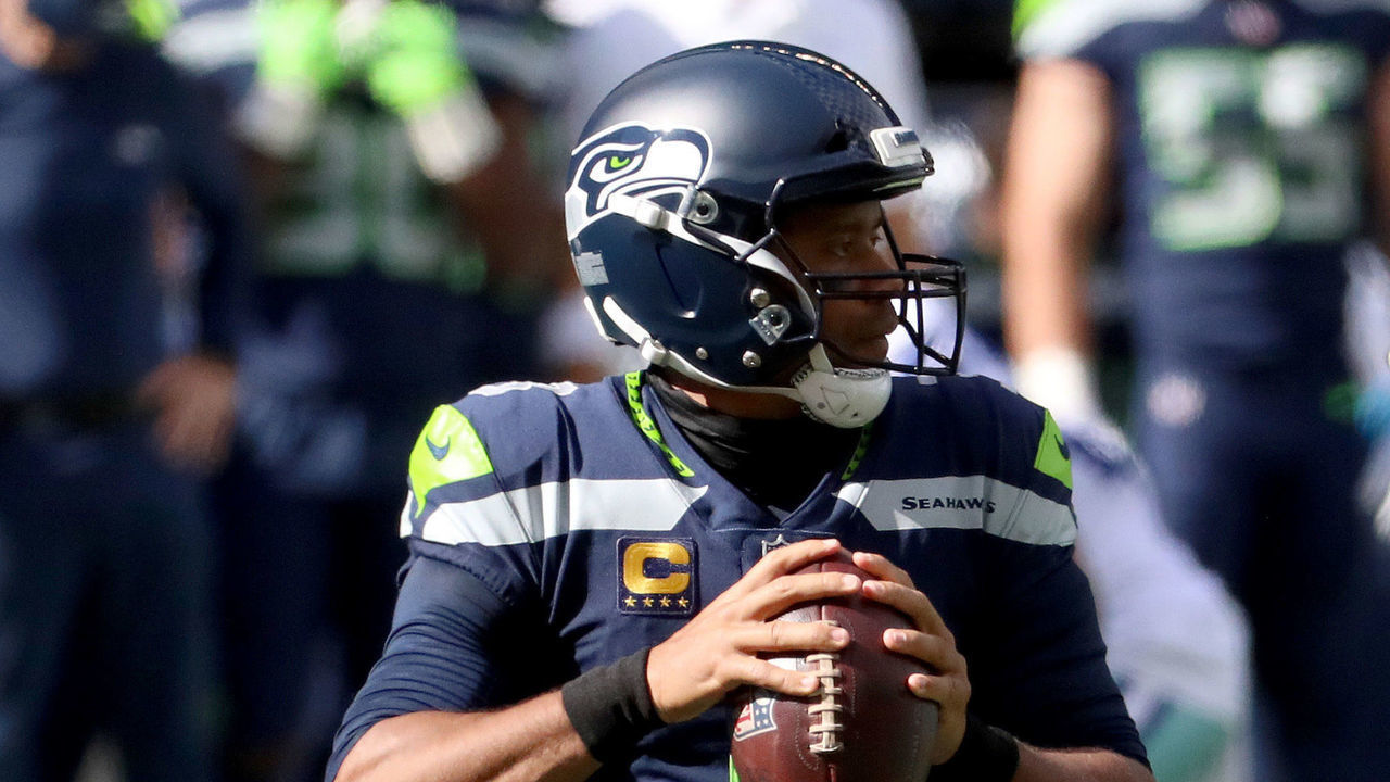 SEATTLE, WASHINGTON - SEPTEMBER 27: Russell Wilson #3 of the Seattle Seahawks looks to throw a pass against the Dallas Cowboys during the first quarter in the game at CenturyLink Field on September 27, 2020 in Seattle, Washington.