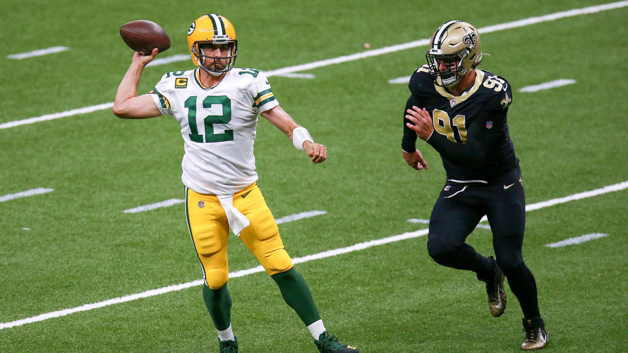 NEW ORLEANS, LOUISIANA - SEPTEMBER 27: Aaron Rodgers #12 of the Green Bay Packers attempts a pass under pressure from Trey Hendrickson #91 of the New Orleans Saints during the second half at Mercedes-Benz Superdome on September 27, 2020 in New Orleans, Louisiana.