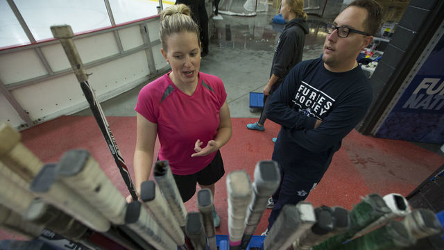 TORONTO, ON - OCTOBER 14: Goalie Sami Jo Small speaks with team equipment manager Patrick Farney at the stick rack. The Toronto Furies open their Canadian Women's Hockey League schedule against the Markham Thunder at the MasterCard Centre for Hockey Excellence. Toronto Star/Rick Madonik (Rick Madonik/Toronto Star via Getty Images)
