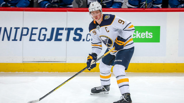 WINNIPEG, MB - MARCH 3: Jack Eichel #9 of the Buffalo Sabres plays the puck down the ice during first period action against the Winnipeg Jets at the Bell MTS Place on March 3, 2020 in Winnipeg, Manitoba, Canada. The Jets defeated the Sabres 3-1.