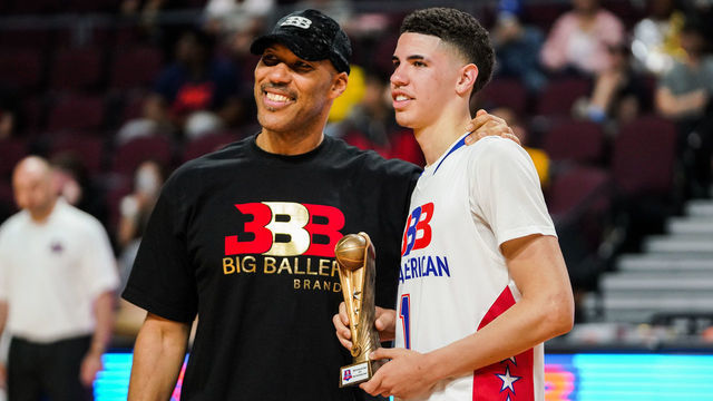 LAS VEGAS, NEVADA - MARCH 31: LaVar Ball presents an award to son LaMelo Ball after the Big Baller Brand All American Game at the Orleans Arena on March 31, 2019 in Las Vegas, Nevada.