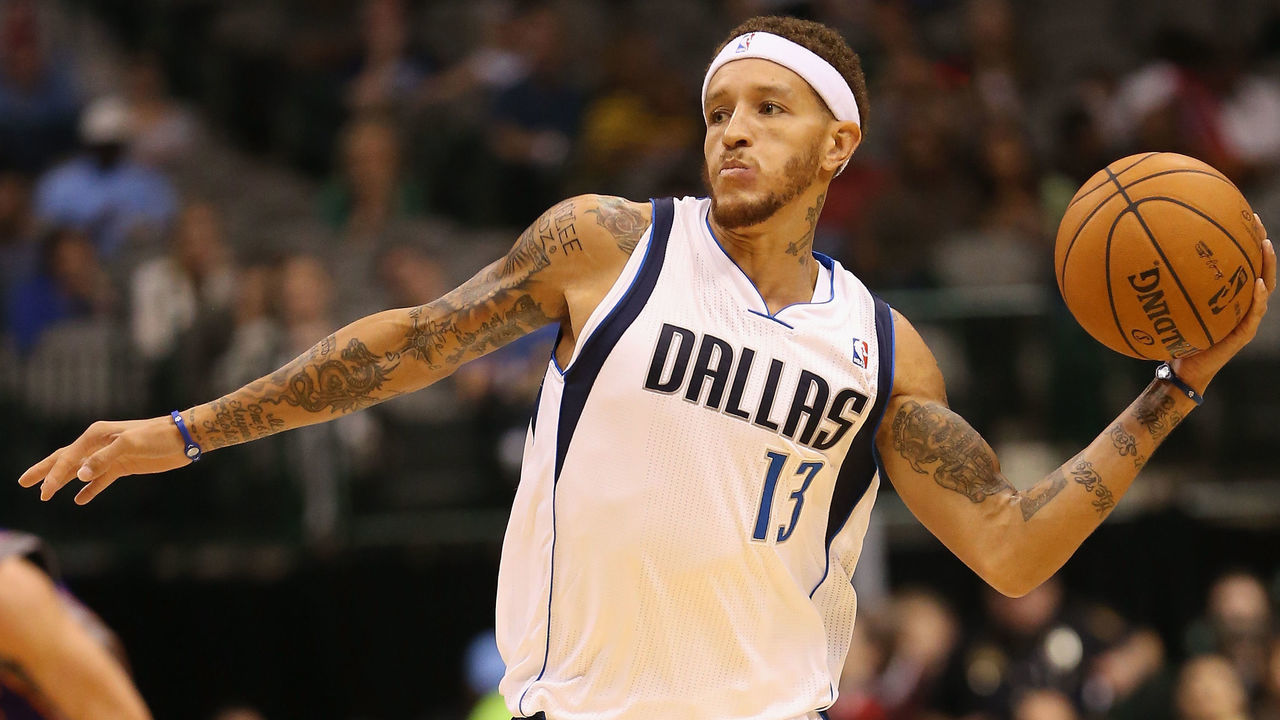 DALLAS, TX - OCTOBER 17: Delonte West #13 of the Dallas Mavericks passes the ball against the Phoenix Suns during a preseason game at American Airlines Center on October 17, 2012 in Dallas, Texas.