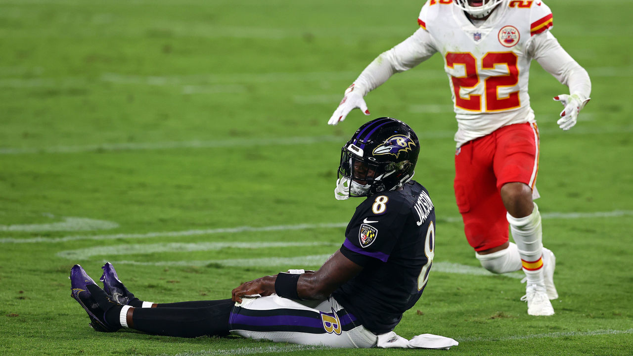 BALTIMORE, MARYLAND - SEPTEMBER 28: Lamar Jackson #8 of the Baltimore Ravens reacts after being knocked down in front of Juan Thornhill #22 of the Kansas City Chiefs at M&T Bank Stadium on September 28, 2020 in Baltimore, Maryland.