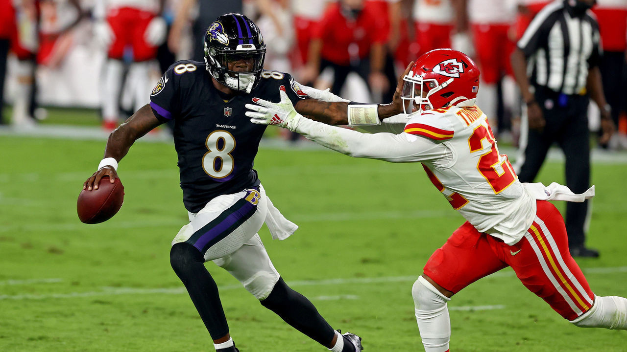 BALTIMORE, MARYLAND - SEPTEMBER 28: Lamar Jackson #8 of the Baltimore Ravens stiff arms Juan Thornhill #22 of the Kansas City Chiefs at M&T Bank Stadium on September 28, 2020 in Baltimore, Maryland.