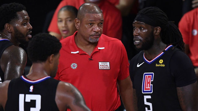 LAKE BUENA VISTA, FLORIDA - SEPTEMBER 03: Doc Rivers of the LA Clippers talks with Montrezl Harrell #5 of the LA Clippers and Paul George #13 of the LA Clippers during the fourth quarter against the Denver Nuggets in Game One of the Western Conference Second Round during the 2020 NBA Playoffs at AdventHealth Arena at the ESPN Wide World Of Sports Complex on September 03, 2020 in Lake Buena Vista, Florida.