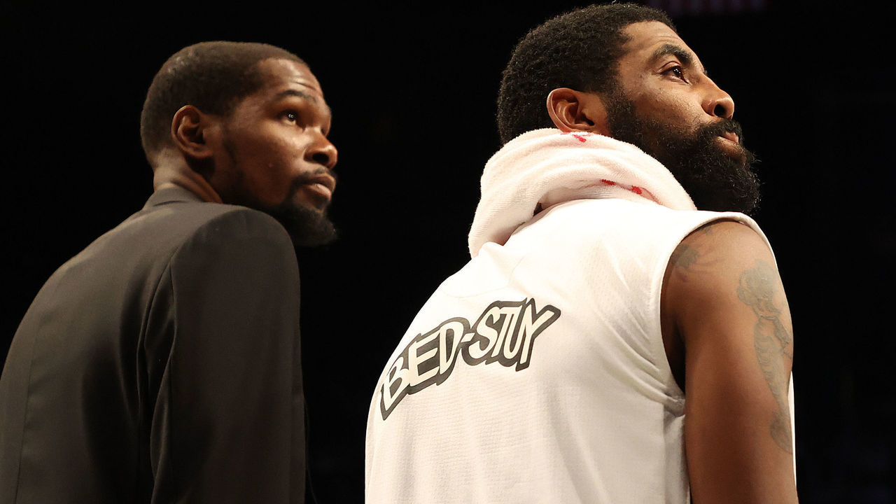 NEW YORK, NEW YORK - JANUARY 18: Kevin Durant #7 and Kyrie Irving #11 of the Brooklyn Nets look on during their game against the Milwaukee Bucks at Barclays Center on January 18, 2020 in New York City. NOTE TO USER: User expressly acknowledges and agrees that, by downloading and/or using this photograph, user is consenting to the terms and conditions of the Getty Images License Agreement.
