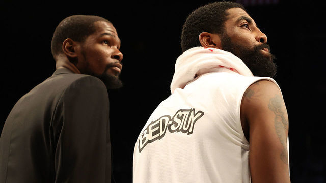 NEW YORK, NEW YORK - JANUARY 18: Kevin Durant #7 and Kyrie Irving #11 of the Brooklyn Nets look on during their game against the Milwaukee Bucks at Barclays Center on January 18, 2020 in New York City. NOTE TO USER: User expressly acknowledges and agrees that, by downloading and/or using this photograph, user is consenting to the terms and conditions of the Getty Images License Agreement.