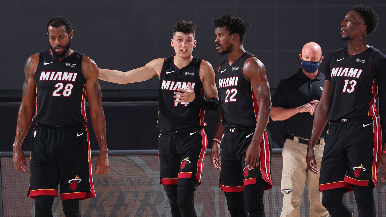 ORLANDO, FL - SEPTEMBER 23: Andre Iguodala #28, Tyler Herro #14, Jimmy Butler #22, and Bam Adebayo #13 of the Miami Heat looks on during the game against the Boston Celtics during Game Four of the Eastern Conference Finals of the NBA Playoffs on September 23, 2020 at The AdventHealth Arena at ESPN Wide World Of Sports Complex in Orlando, Florida. NOTE TO USER: User expressly acknowledges and agrees that, by downloading and/or using this Photograph, user is consenting to the terms and conditions of the Getty Images License Agreement. Mandatory Copyright Notice: Copyright 2020 NBAE