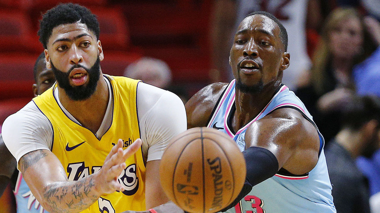 MIAMI, FLORIDA - DECEMBER 13: Anthony Davis #3 of the Los Angeles Lakers battles with Bam Adebayo #13 of the Miami Heat during the second half at American Airlines Arena on December 13, 2019 in Miami, Florida. NOTE TO USER: User expressly acknowledges and agrees that, by downloading and/or using this photograph, user is consenting to the terms and conditions of the Getty Images License Agreement