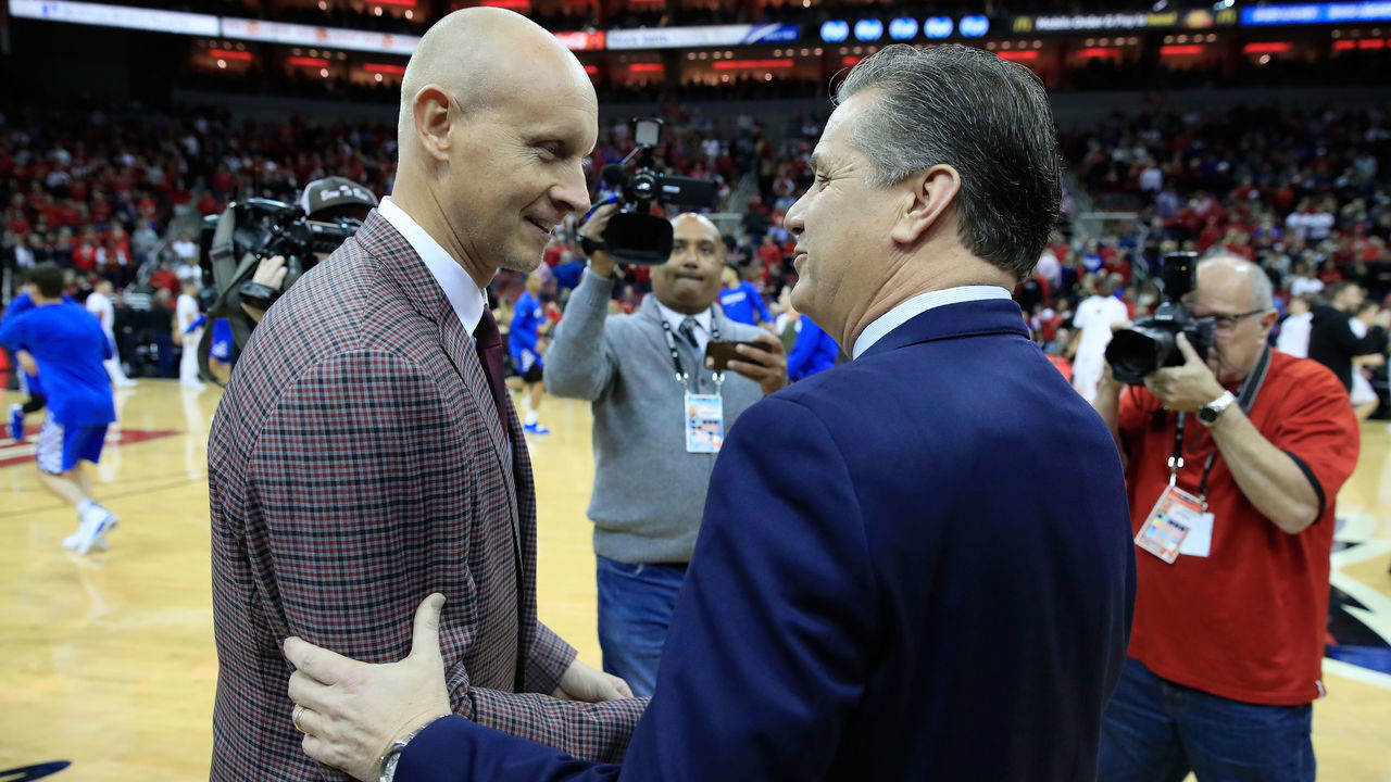 LOUISVILLE, KY - DECEMBER 29: Chris Mack the head coach of the the Louisville Cardinals and John Calipari the head coach of the Kentucky Wildcats talk before the game at KFC YUM! Center on December 29, 2018 in Louisville, Kentucky.