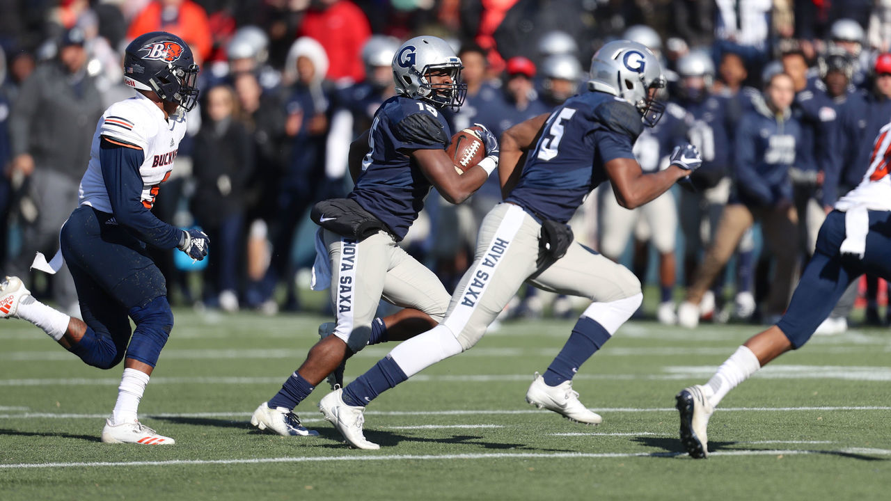 WASHINGTON, DC - NOVEMBER 10: Georgetown Hoyas quarterback Herman Moultrie III (15) advances the ball during the Patriot League college football game between the Georgetown Hoyas and the Bucknell Bisons on November 10, 2018 at Cooper Field in Washington, DC.