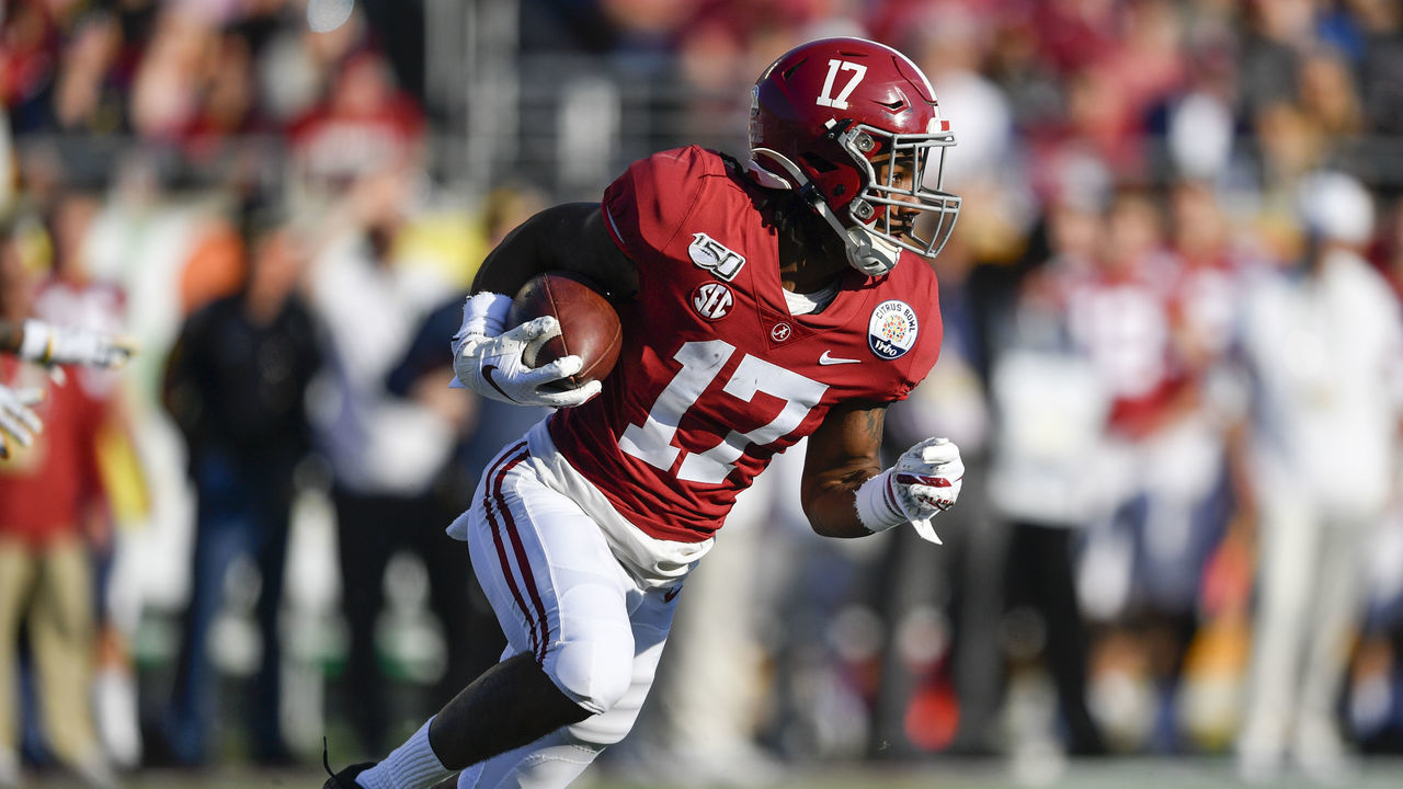 ORLANDO, FL - JANUARY 01: Alabama Crimson Tide wide receiver Jaylen Waddle (17) returns a punt during the second half of the Citrus Bowl between the Michigan Wolverines and the Alabama Crimson Tide on January 01, 2020, at Camping World Stadium in Orlando, FL.