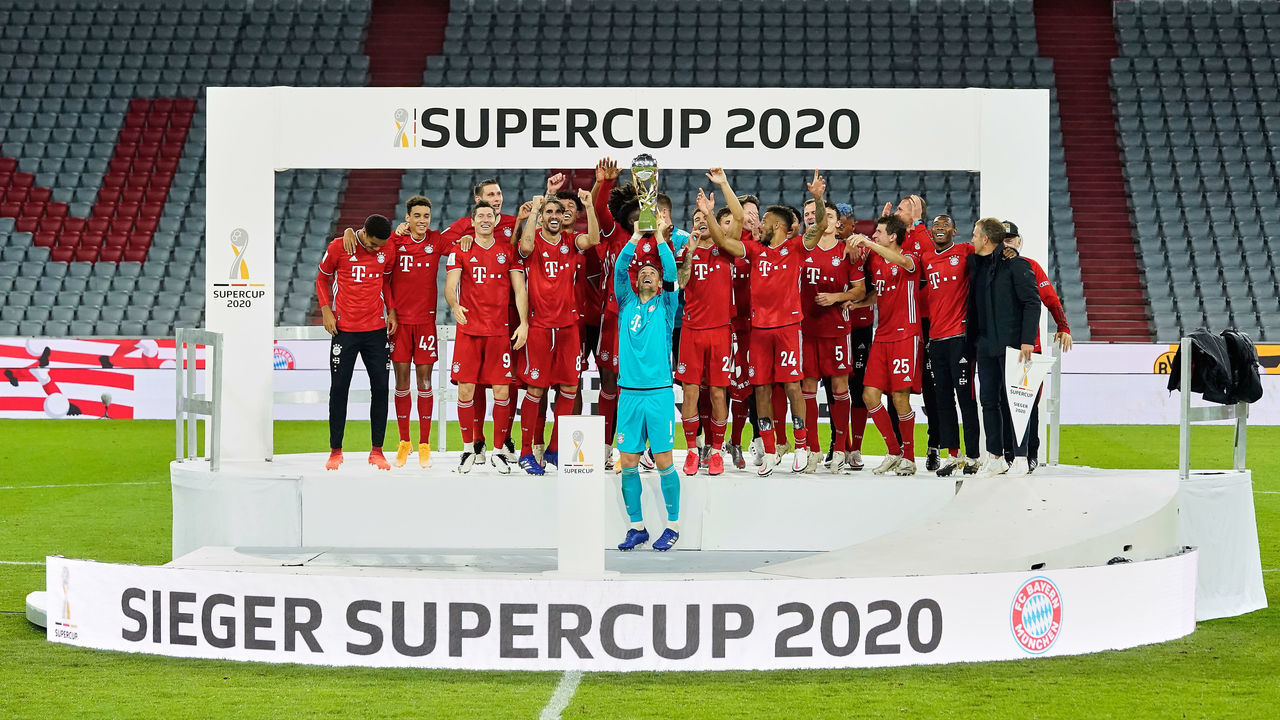 MUNICH, GERMANY - SEPTEMBER 30: Goalkeeper Manuel Neuer of FC Bayern Munich lifts the Supercup 2020 trophy following his team's victory in the Supercup 2020 match between FC Bayern München and Borussia Dortmund at Allianz Arena on September 30, 2020 in Munich, Germany.