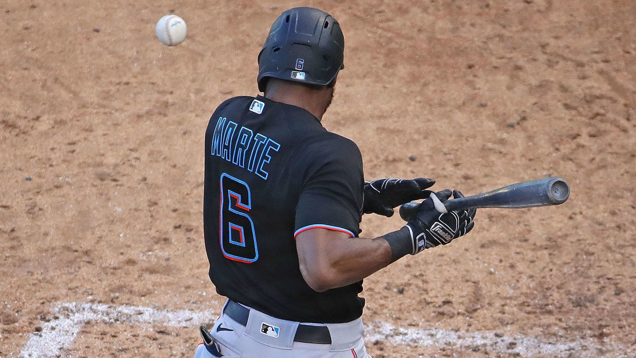 CHICAGO, ILLINOIS - SEPTEMBER 30: Starling Marte #6 of the Miami Marlins is hit by a pitch in the 9th inning against the Chicago Cubs during Game One of the National League Wild Card Series at Wrigley Field on September 30, 2020 in Chicago, Illinois. The Marlins defeated the Cubs 5-1.