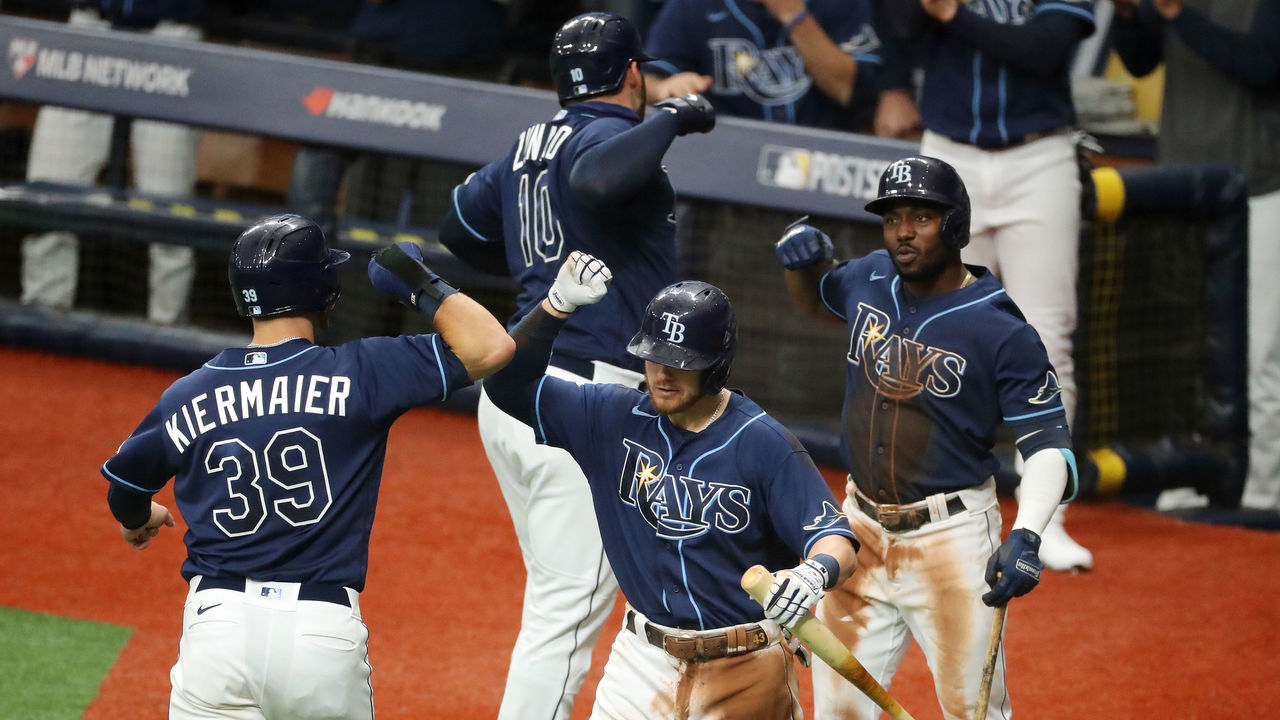 ST. PETERSBURG, FL - SEPTEMBER 30: Kevin Kiermaier #39 and Mike Zunino #10 of the Tampa Bay Rays are congratulated by Mike Brosseau #43 and Randy Arozarena #56 after Zunino's two-run home run in the second inning during Game 2 of the Wild Card Series between the Toronto Blue Jays and the Tampa Bay Rays at Tropicana Field on Wednesday, September 30, 2020 in St. Petersburg, Florida.