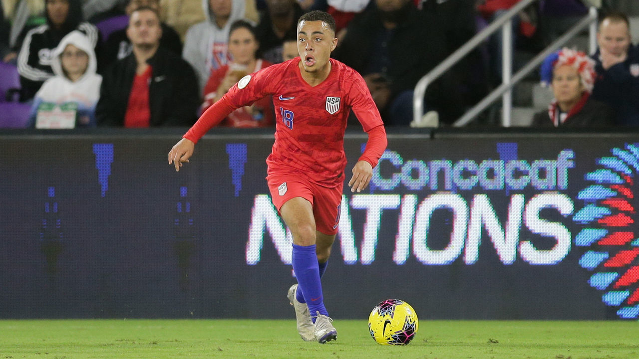 ORLANDO, FL - NOVEMBER 15: Sergino Dest #18 oof the United States looks for an open man downfield during a game between Canada and USMNT at Exploria Stadium on November 15, 2019 in Orlando, Florida.