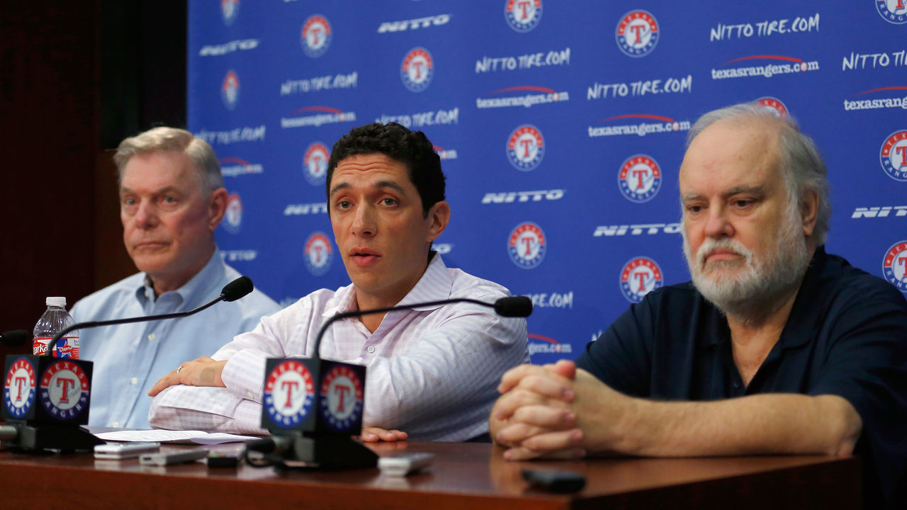 ARLINGTON, TX - SEPTEMBER 05: (L-R) Owner Ray Davis of the Texas Rangers, President of Baseball Operations and General Manager Jon Daniels of the Texas Rangers, and Owner Bob Simpson of the Texas Rangers talk with the media after announcing the resignation of Manager Ron Washington at Globe Life Park in Arlington on September 5, 2014 in Arlington, Texas. Ron Washington informed the club that he has chosen to resign in order to turn his full attention to addressing an off-the-field personal matter.