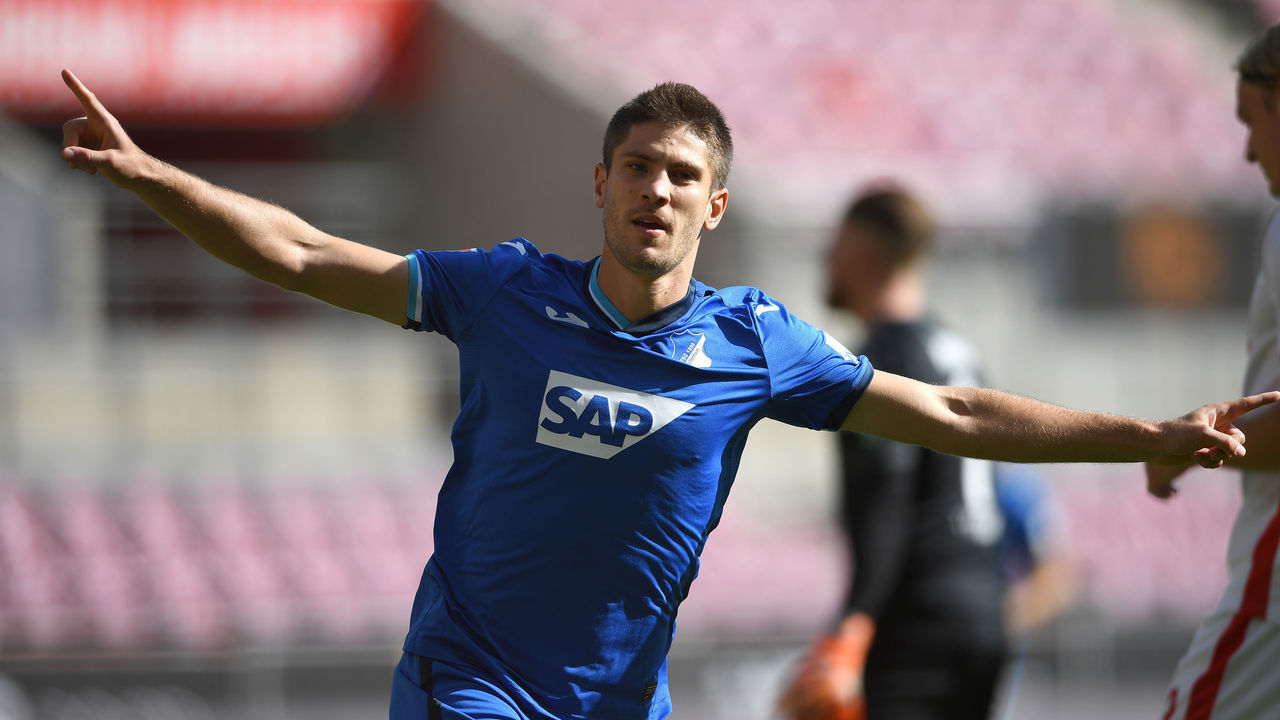 COLOGNE, GERMANY - SEPTEMBER 19: Andrej Kramaric of TSG 1899 Hoffenheim celebrates after scoring his team's first goal during the Bundesliga match between 1. FC Koeln and TSG Hoffenheim at RheinEnergieStadion on September 19, 2020 in Cologne, Germany. Fans are set to return to Bundesliga stadiums in Germany despite to the ongoing Coronavirus Pandemic. Up to 20% of stadium's capacity are allowed to be filled. Final decisions are left to local health authorities and are subject to club's hygiene concepts and the infection numbers in the corresponding region. The match in Cologne is played behind closed doors due to the high number of new Covid-19 cases in the city of Cologne.