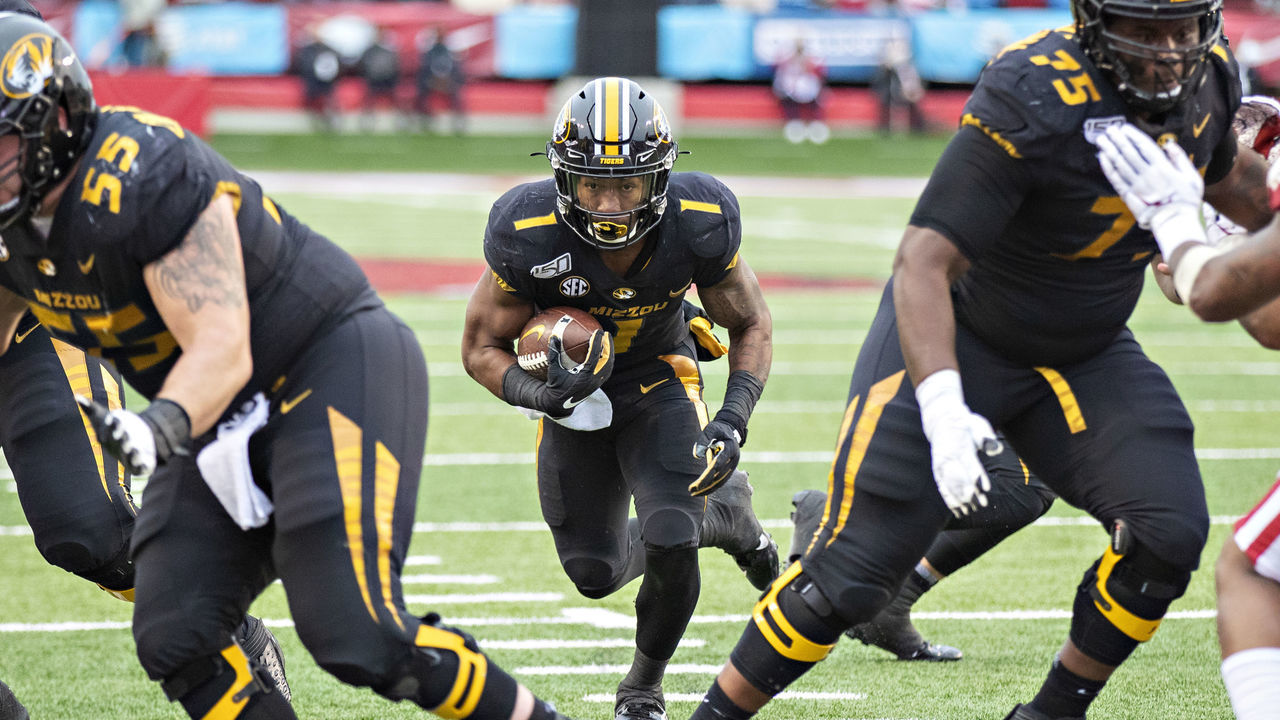 LITTLE ROCK, AR - NOVEMBER 29: Tyler Badie #1 of the Missouri Tigers runs the ball during a game against the Arkansas Razorbacks at War Memorial Stadium on November 29, 2019 in Little Rock, Arkansas The Tigers defeated the Razorbacks 24-14.